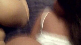 African beauty with oiled buttocks and a sex doll