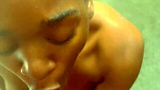 Young African American girl enjoys giving oral pleasure