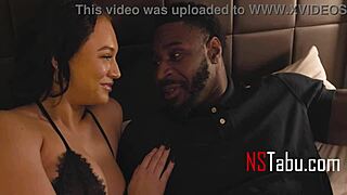 A slender yet voluptuous married woman with ample bosom enjoys intimate relations with a well-endowed black man