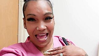 A busty ebony woman experiences intense pleasure while working